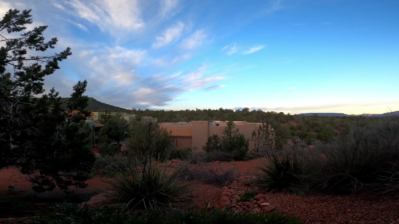 Desert plants and red-rock landscaping beneath a Sedona sky